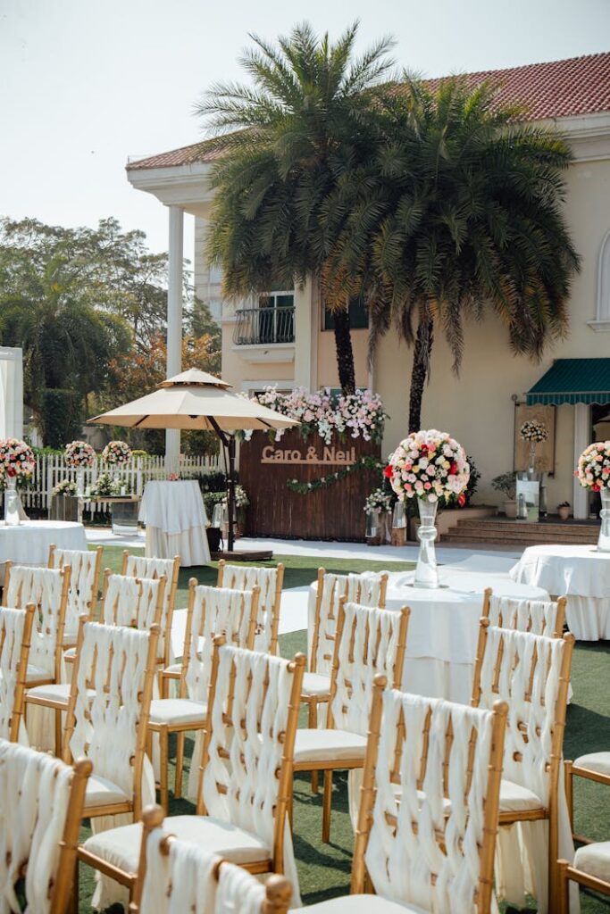 pexels photo 32854440 An elegant outdoor wedding setup with chairs, flowers, and decorations.