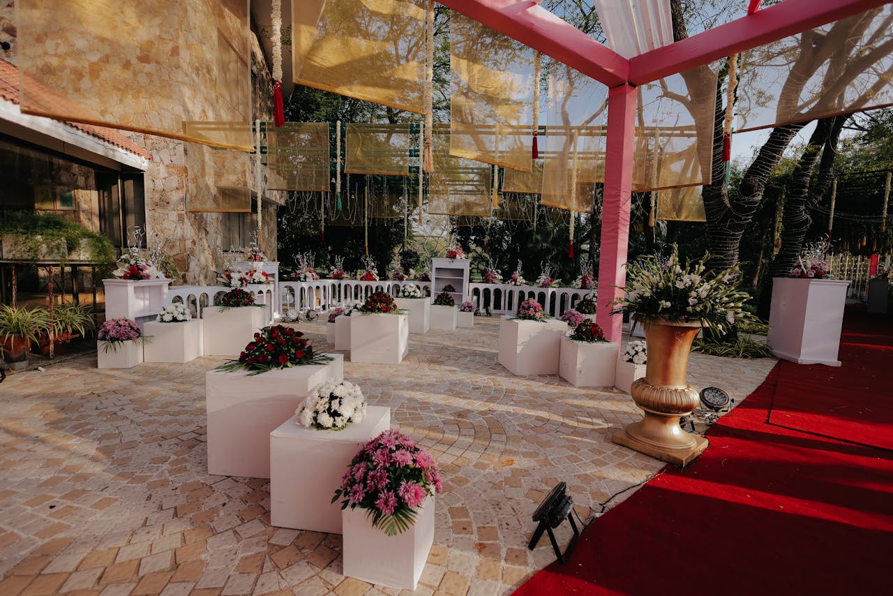services-01 Beautifully decorated outdoor wedding venue with floral arrangements and canopy.